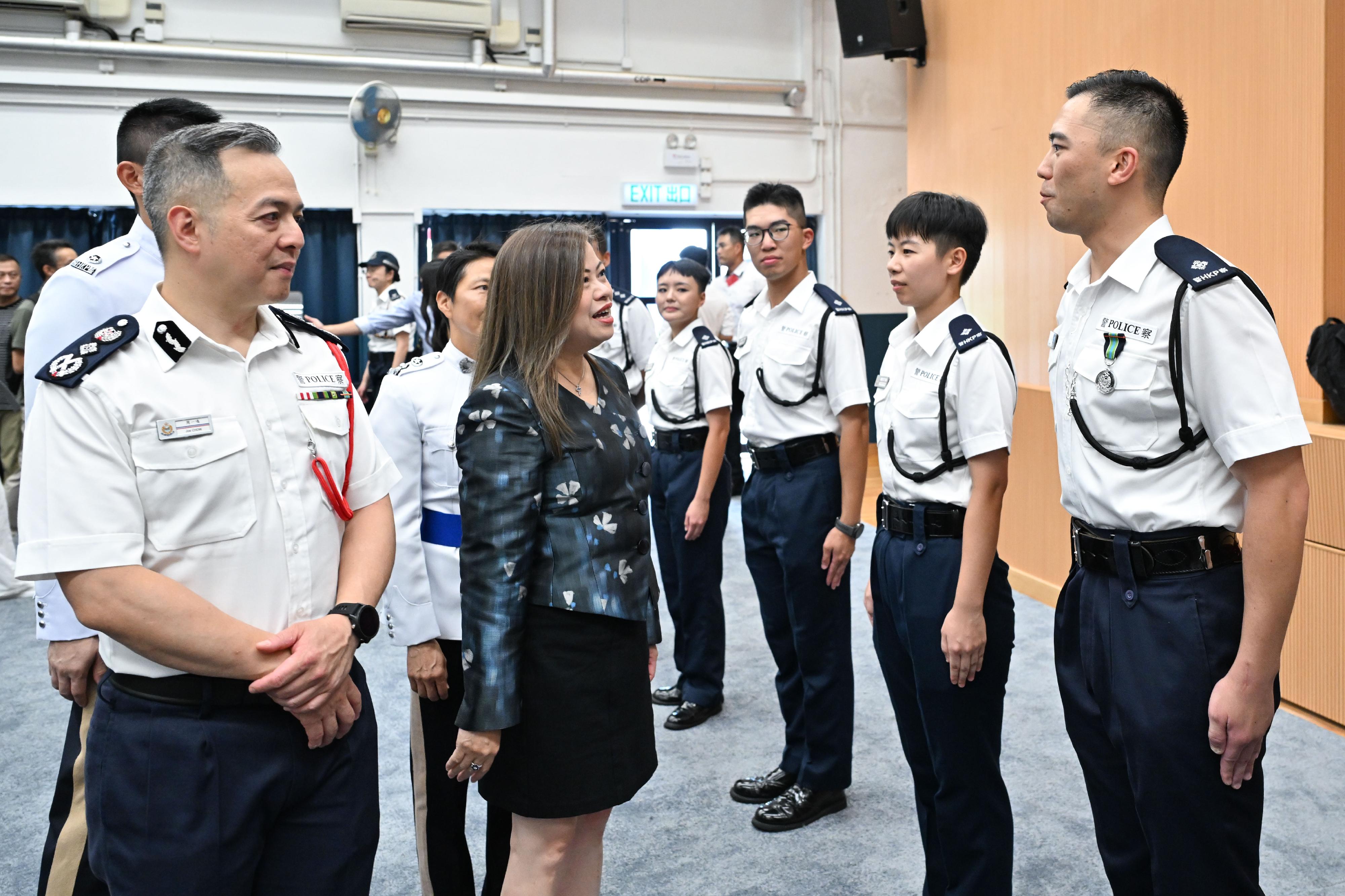 The Secretary for Culture, Sports and Tourism, Miss Rosanna Law (front row, second left), and the Commissioner of Police, Mr Chow Yat-ming (front row, first left), congratulate the probationary inspectors after the passing-out parade held at the Hong Kong Police College today (July 11).