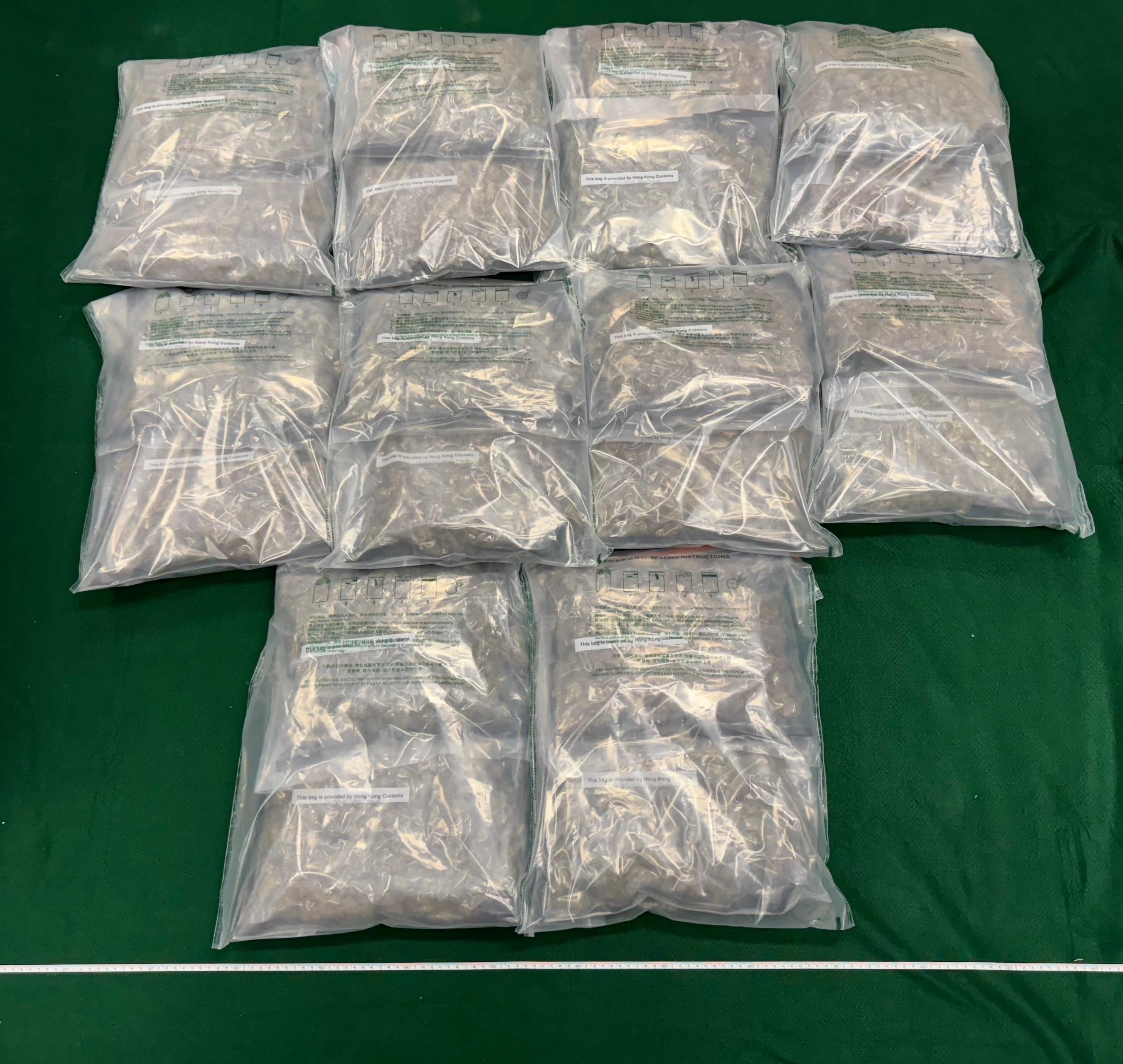 Hong Kong Customs yesterday (July 16) detected two drug trafficking cases involving air passengers at Hong Kong International Airport and seized about 21 kilograms of suspected cannabis buds with an estimated market value of about $3.9 million. Two men were arrested. Photo shows the batch of the suspected cannabis buds seized from the checked-in suitcase of the 19-year-old Malaysian male passenger.