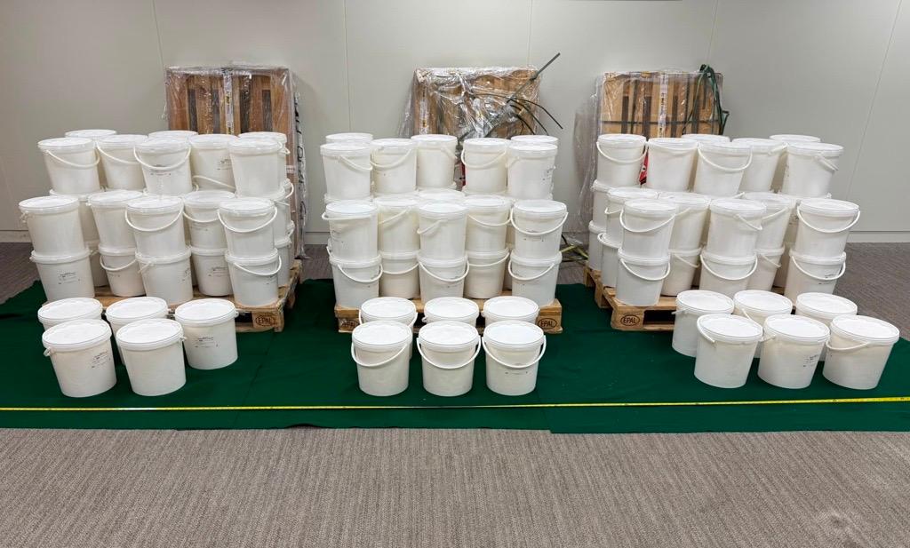 Hong Kong Customs detected a dangerous drug case on July 16, and seized about 131 kilograms of suspected ketamine, with an estimated market value of about $51.4 million. Three persons suspected to be connected with the case were arrested. Photo shows 17 plastic buckets (two front rows) with suspected ketamine concealed inside.