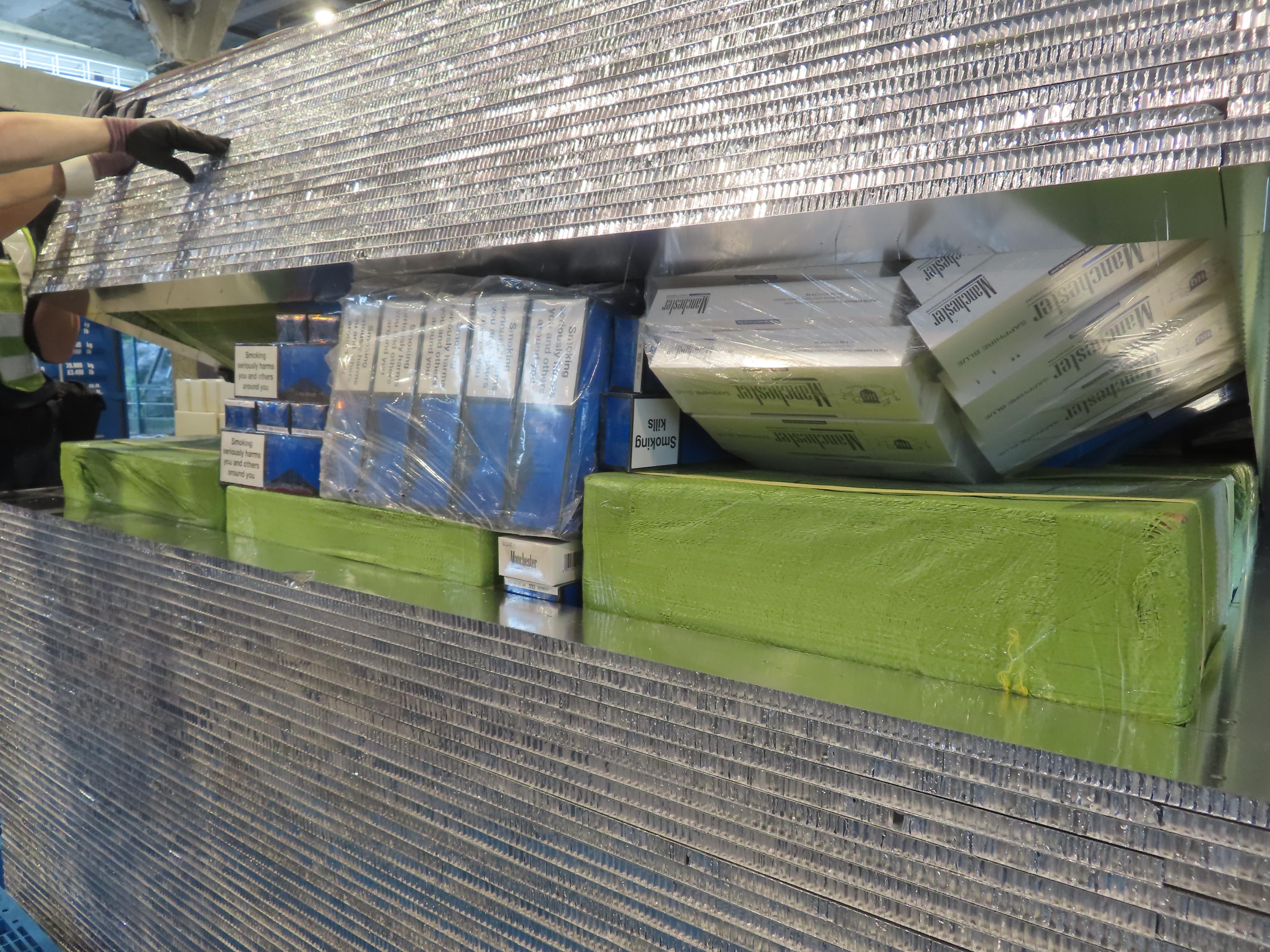 Hong Kong Customs seized about 400 000 suspected illicit cigarettes with an estimated market value of about $1.8 million and a duty potential of about $1.3 million at the Customs Tsing Yi Cargo Examination Compound, yesterday (July 17). Photo shows some of the suspected illicit cigarettes seized.